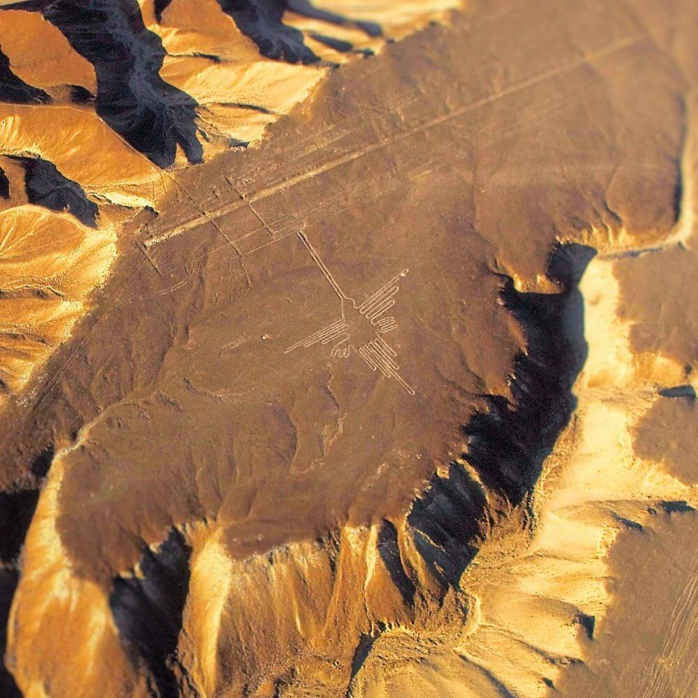 Aerial view of the Hummingbird geoglyph at the Nazca Lines in Peru