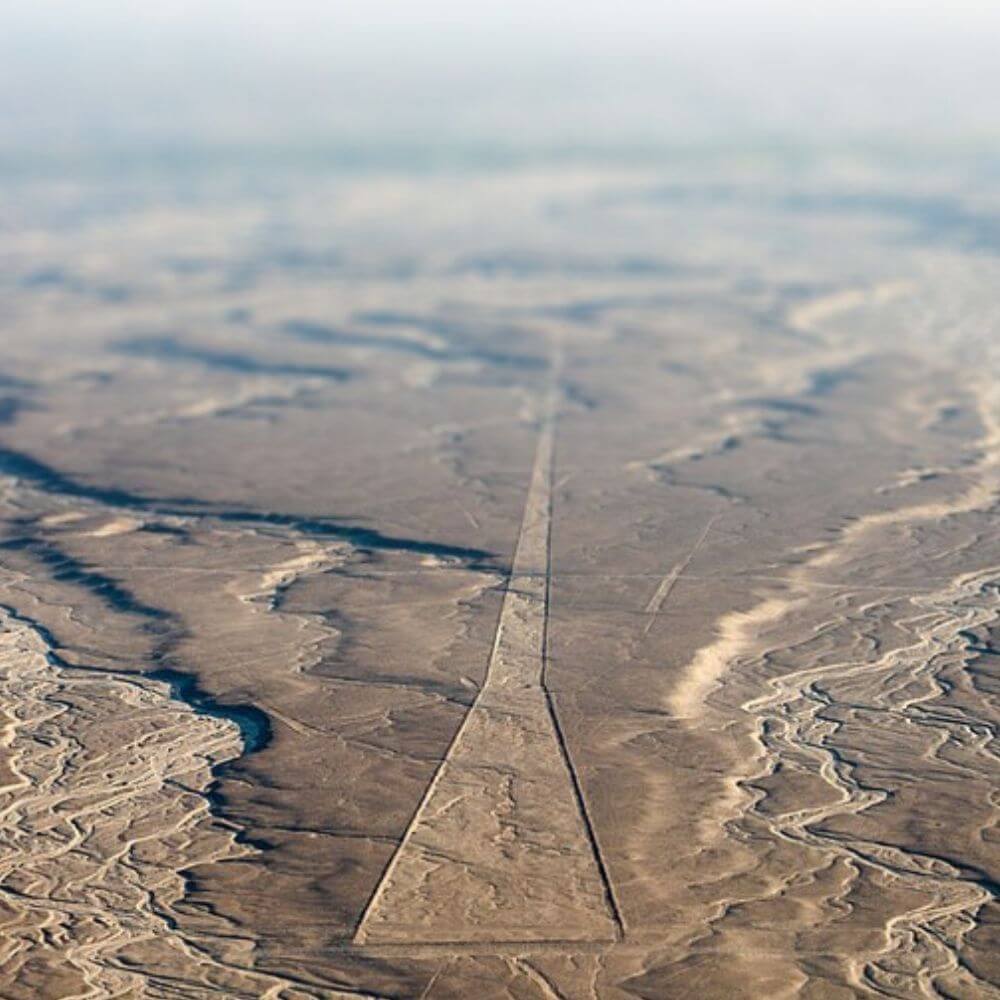 Massive straight Nazca Lines crossing the desert landscape of southern Peru