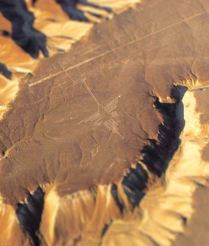 Flying over the Hummingbird geoglyph on the Nazca desert.