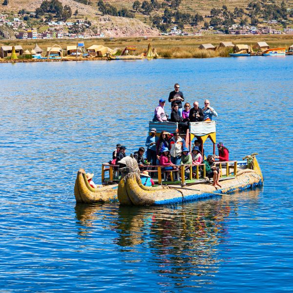 Visiting the Uros Islands by reed boat.