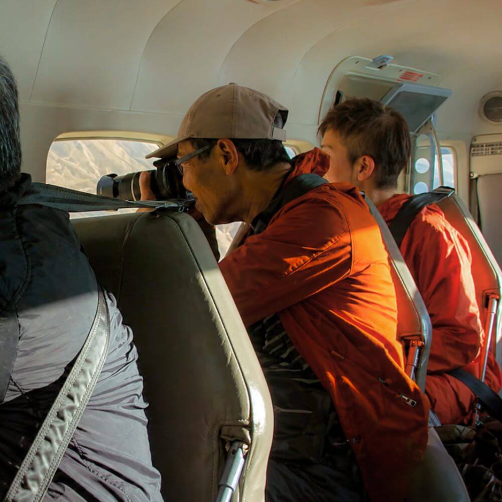 Passenger observing the Nazca Lines during scenic flight