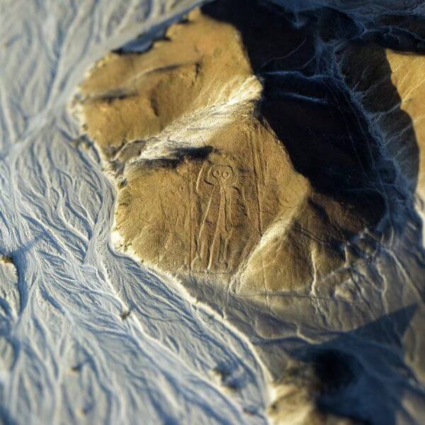 The Astronaut Geoglyph etched on a hill side of Nazca plateau.