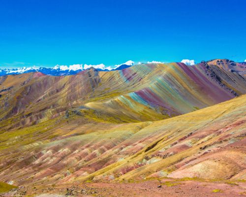 Hike to Rainbow Mountain and witness stunning colorful landscapes.
