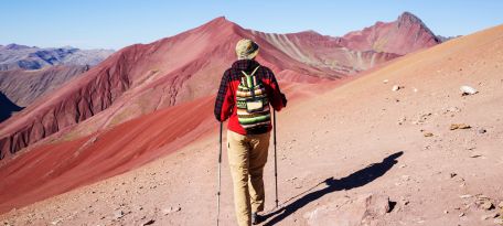 Hikers on the trail to Rainbow Mountain, showcasing vibrant scenery.