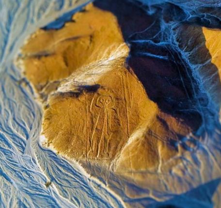 Owl man Geoglyph on a hillside on the Nazca Desert.