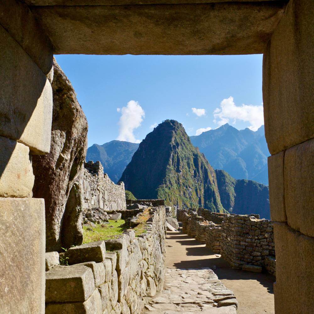 UNESCO World Heritage Site of Machu Picchu surrounded by spectacular Andean peaks and cloud forest in Peru.