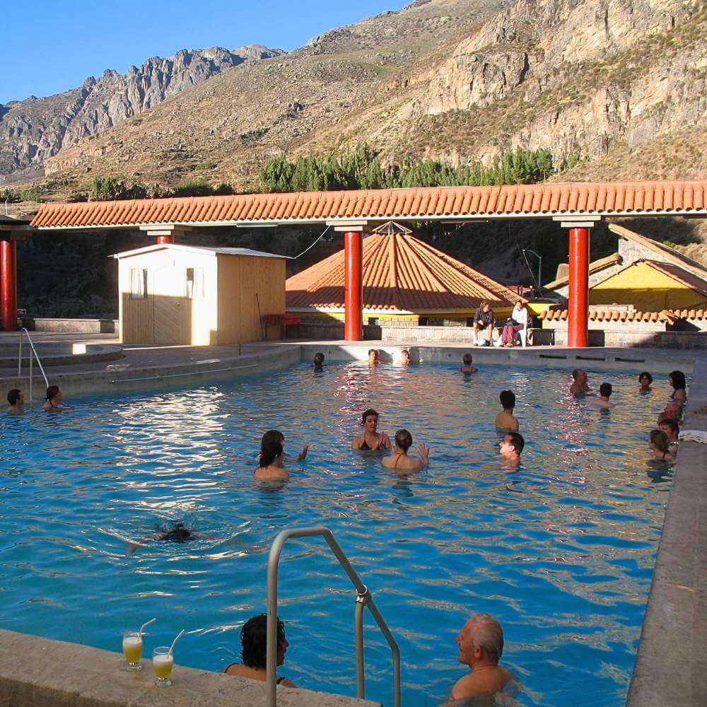 Visitors relaxing in the La Calera Hot Springs during the Colca Canyon Tour from Arequipa, Peru.
