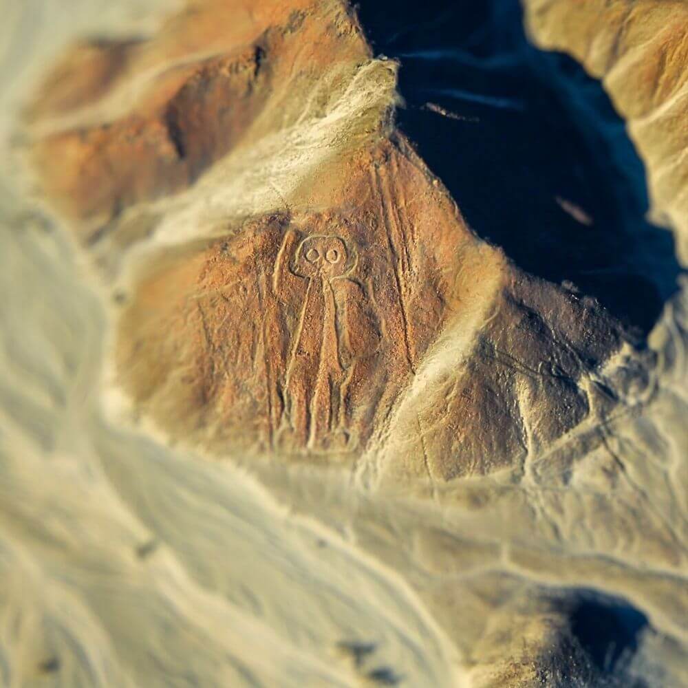 The Astronaut geoglyph carved into a desert hillside, one of the most mysterious figures of the Nazca Lines in Peru.