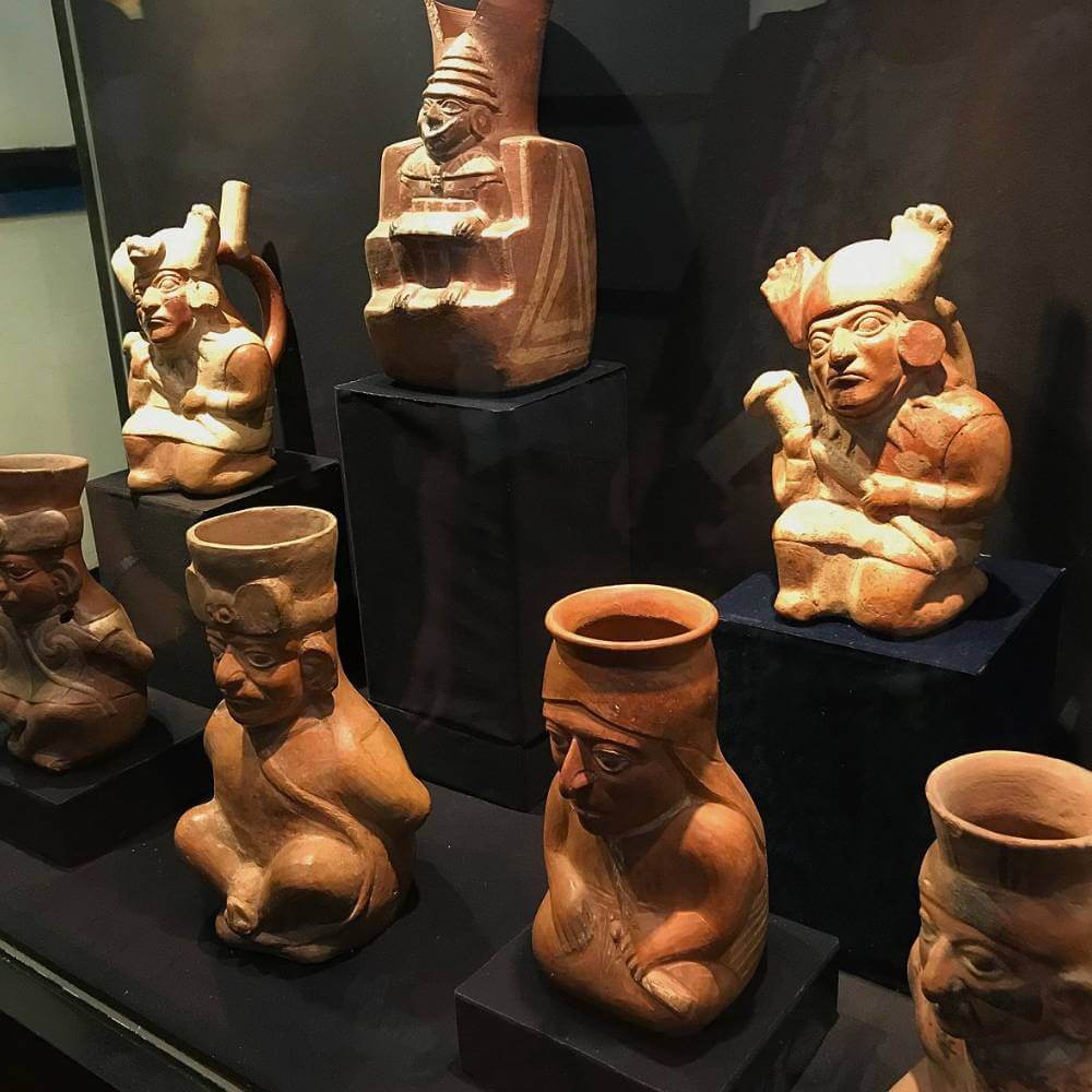 Ancient Moche and Chimú ceramic vessels displayed at the Archaeological and Anthropological Museum of Trujillo, Peru.