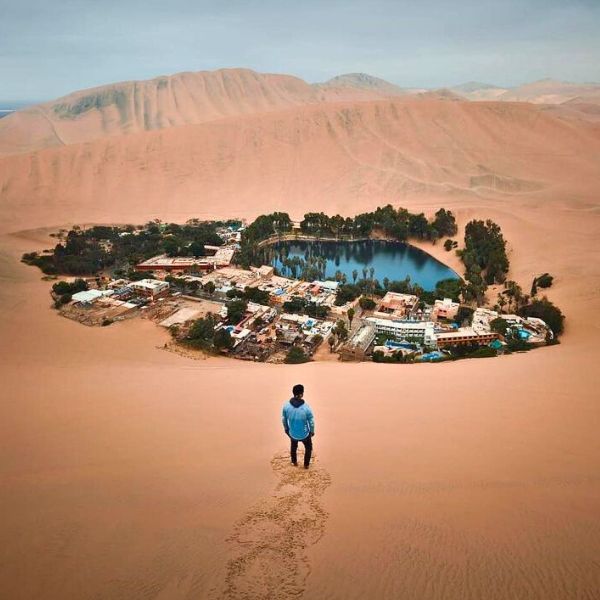 Aerial view of Huacachina Oasis and dunes